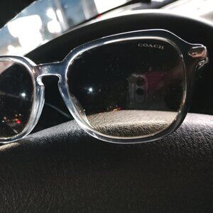 A pair of Coach square women's sunglasses gray transparent